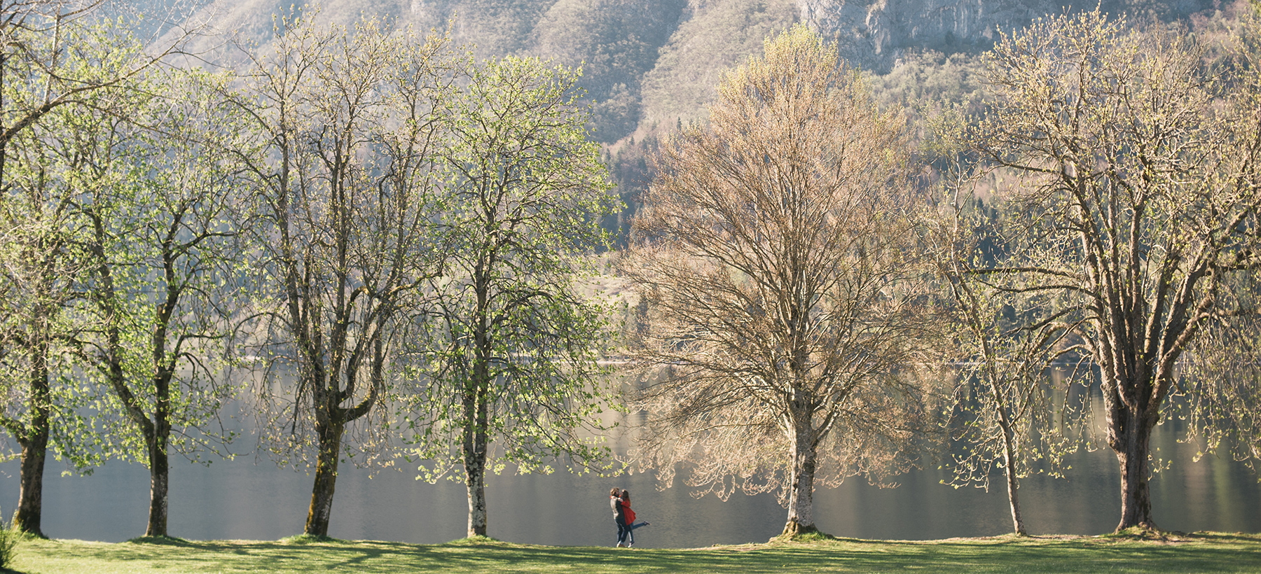 Photograph of a couple near the lake.