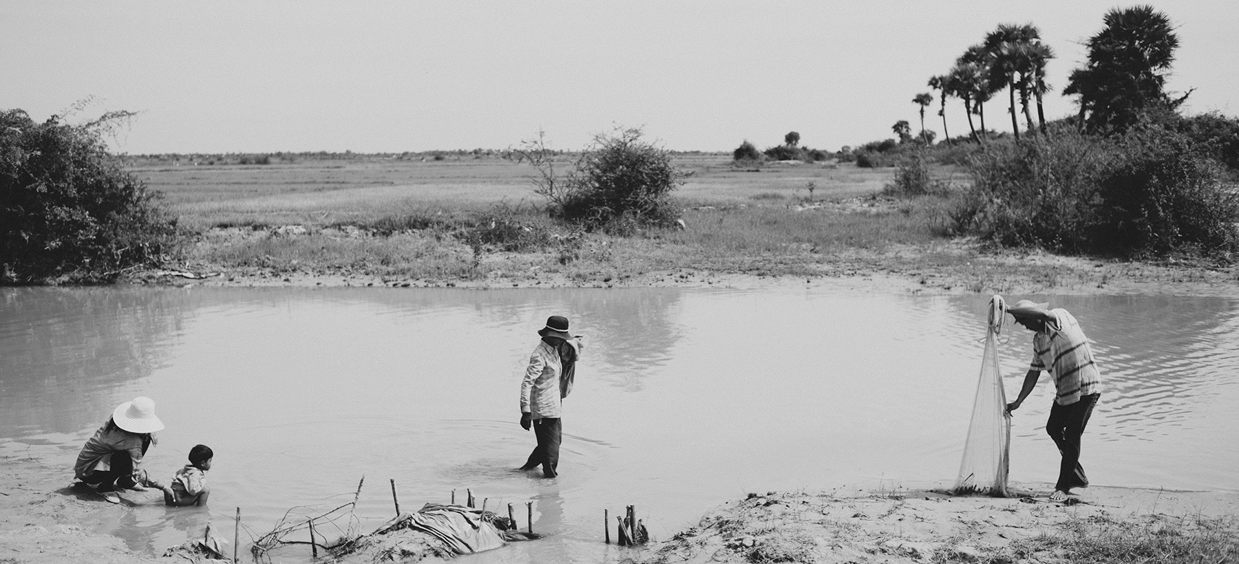 Reportage photography of crab trapping in Cambodia.