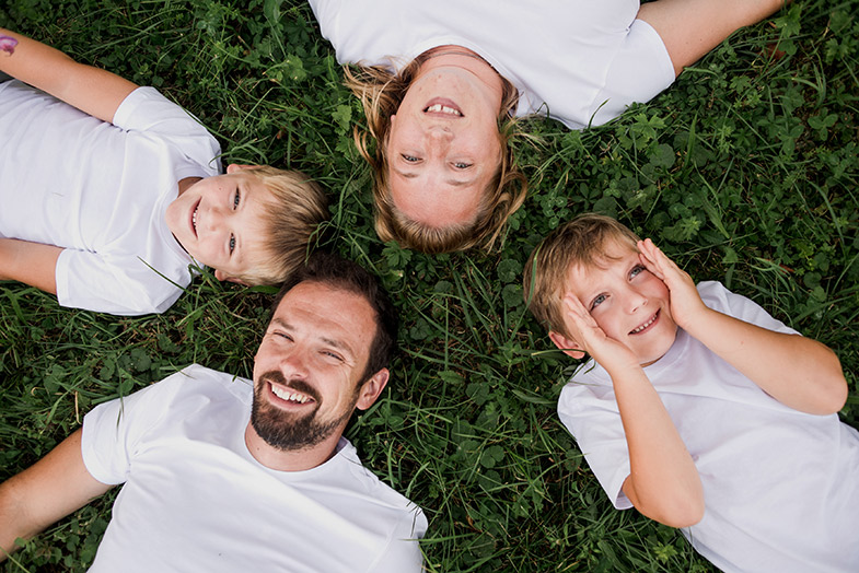 Creative family photography on the lawn.