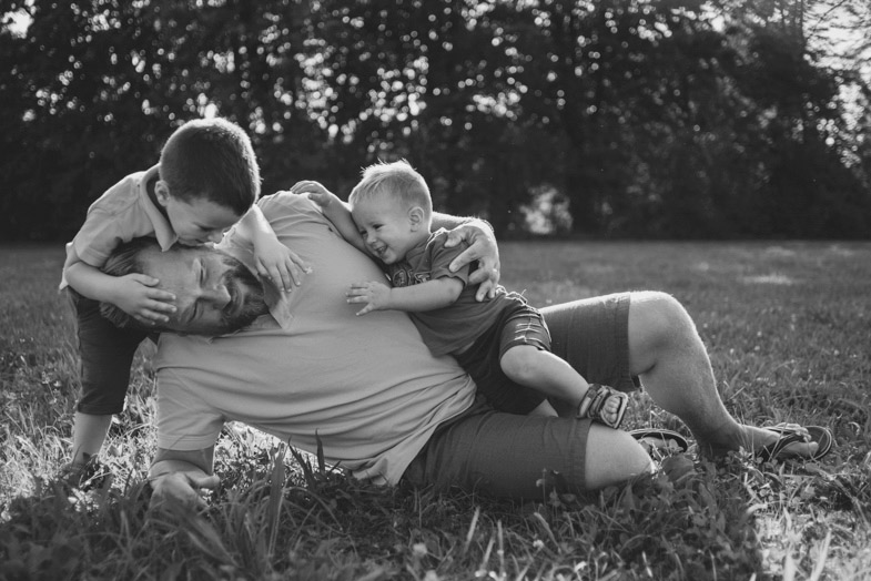 A photo of a father and sons during a game.