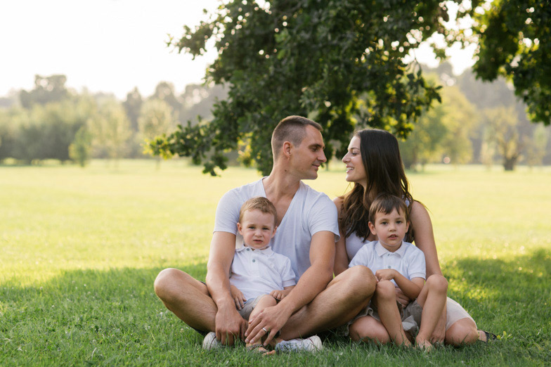 Photograhping a family on a lawn.