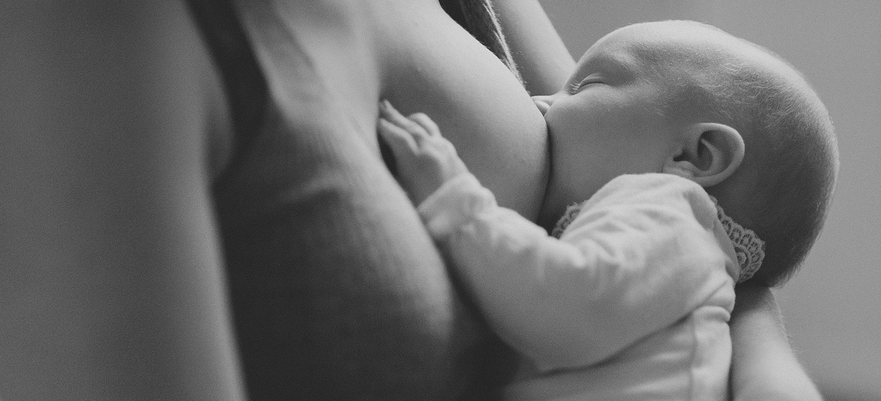 A baby's photograph during breastfeeding.